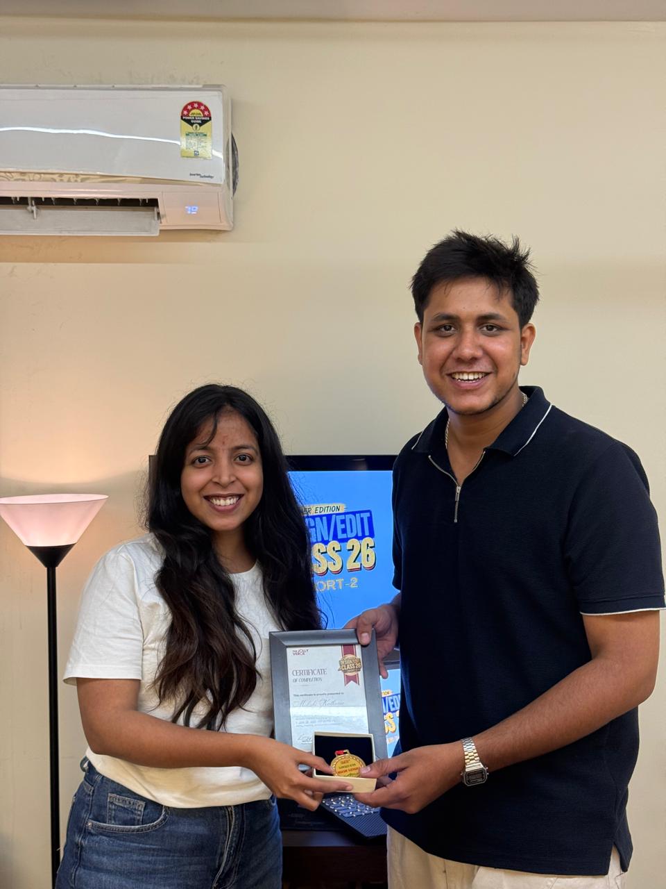 Certificate and medal presented to a Cohort 2 student