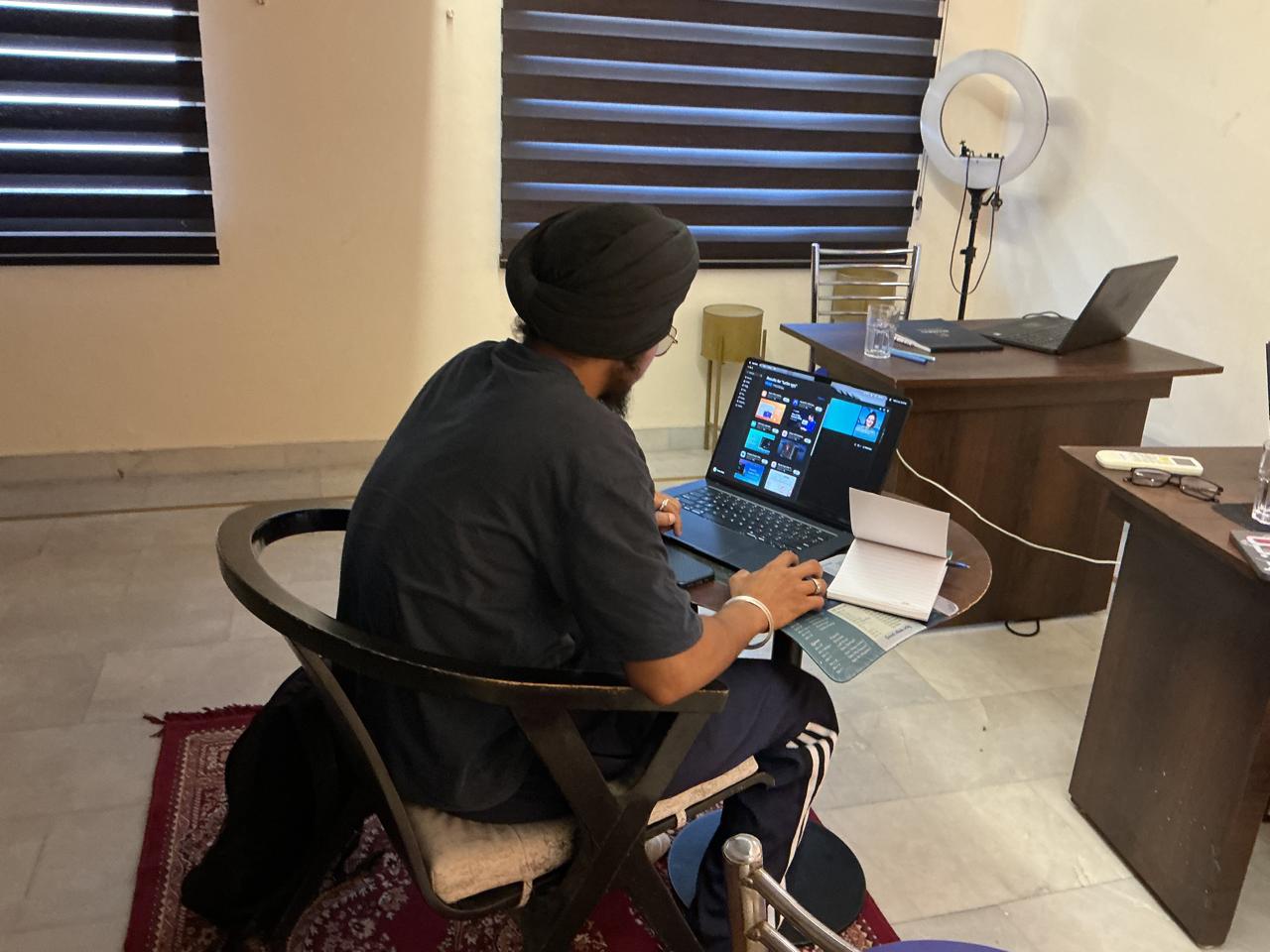 Participant working on design tasks at the studio desk
