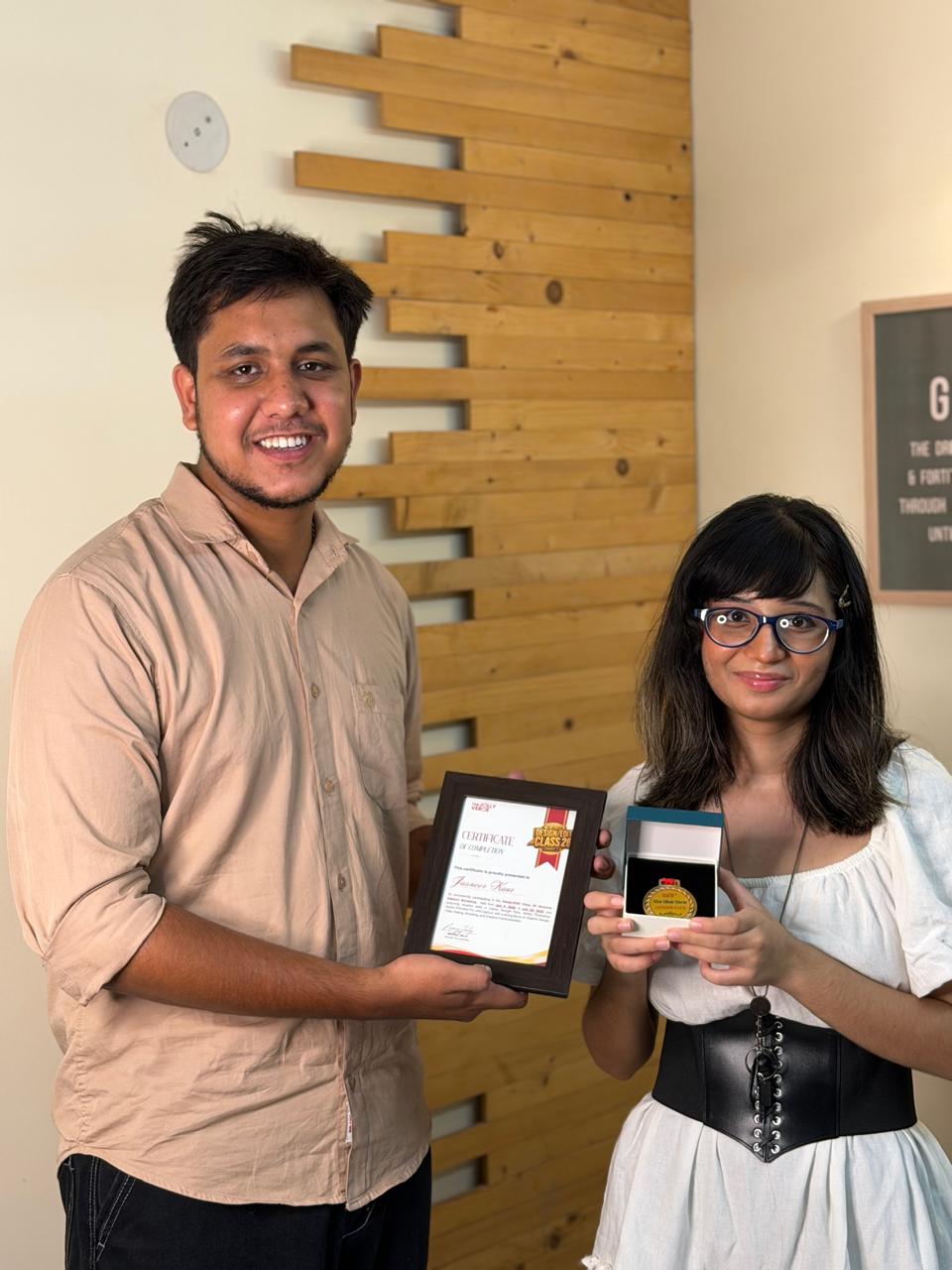 Certificate handover at the studio with medal box